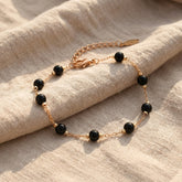 Bransoletka z obsydianem czarnym i miedzią w kolorze złotym - zdjęcie 1